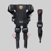 Black crash-tested dog car safety harness with secure buckles on gray background